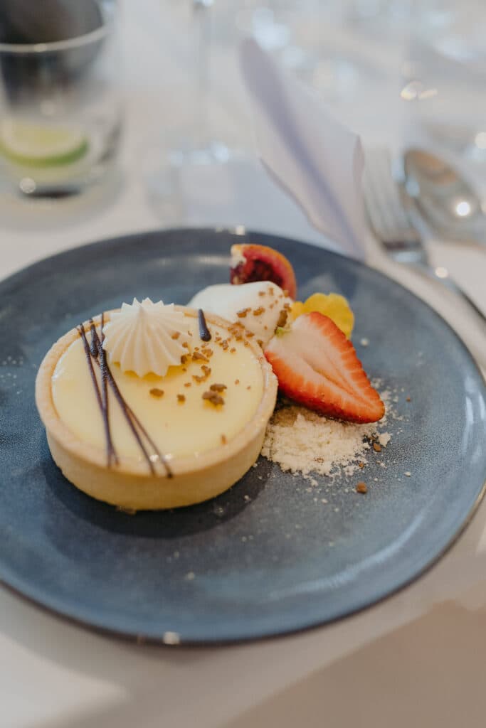A round dessert garnished with strawberry slices