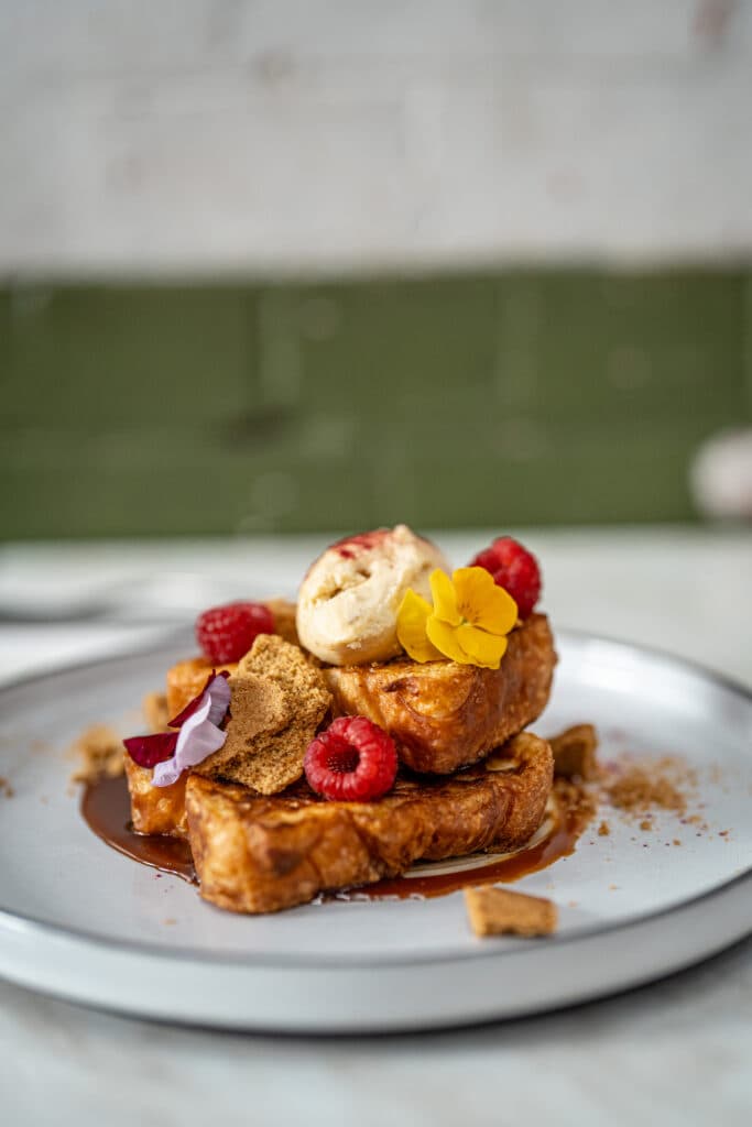 French toast topped with berries and ice cream